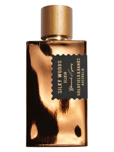 Goldfield & Banks Silky Woods Elixir perfume bottle – blurred decorative background