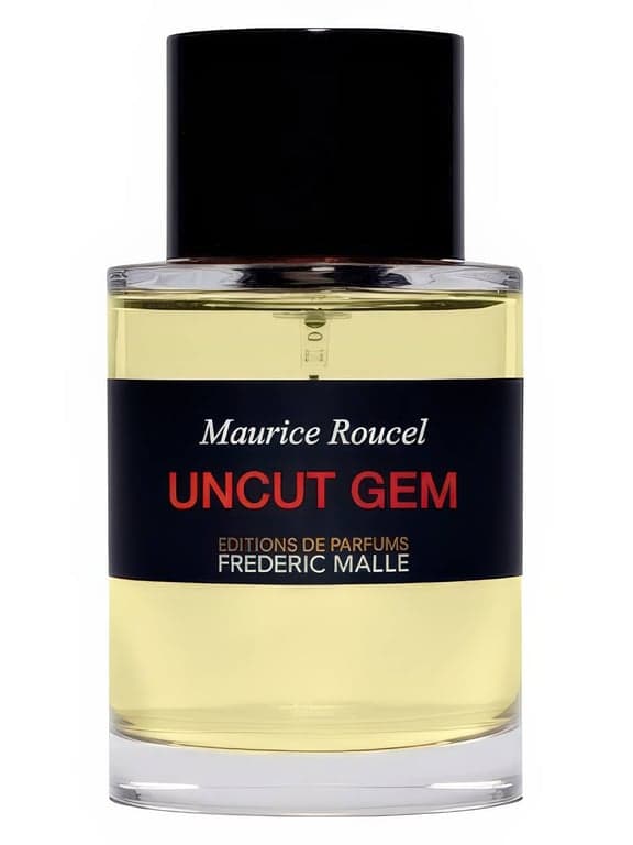 Frederic Malle Uncut Gem perfume bottle – blurred decorative background