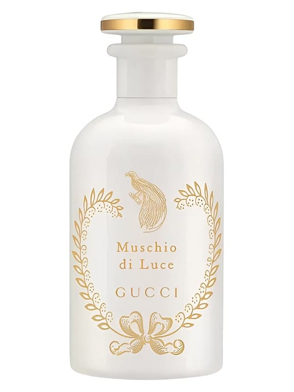 Gucci Muschio di Luce perfume bottle – blurred decorative background