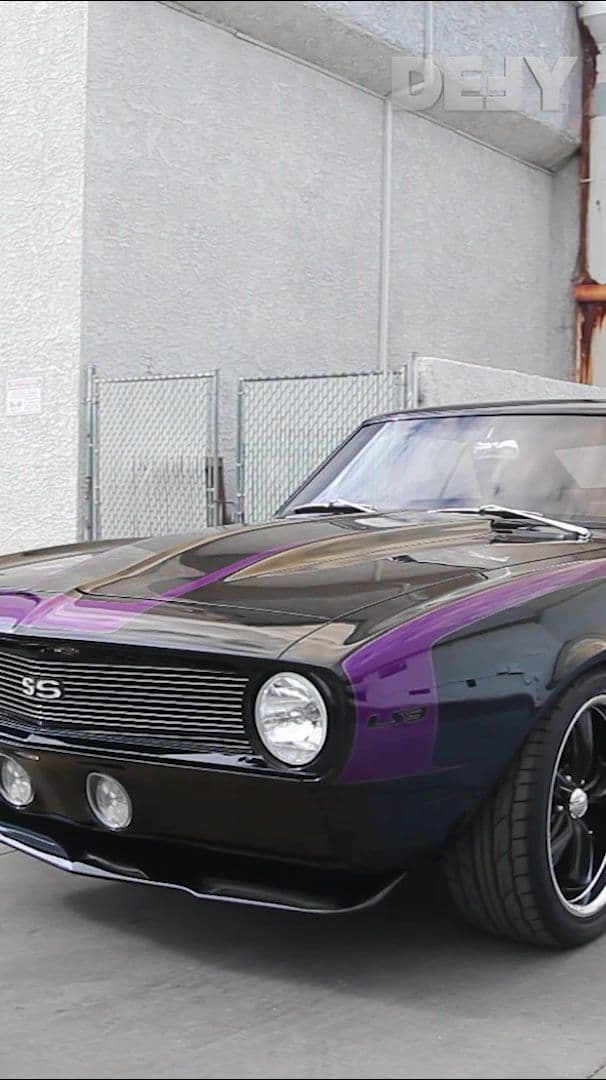 🔥 Old school muscle with a need for speed. Black body, purple stripes, and pure power 👉 Would you drive this sweet ’68 Camaro or just keep it on display? . . . #countingars #countskustoms #camaro #chevroletcamaro #customcars #foryou #DEFY