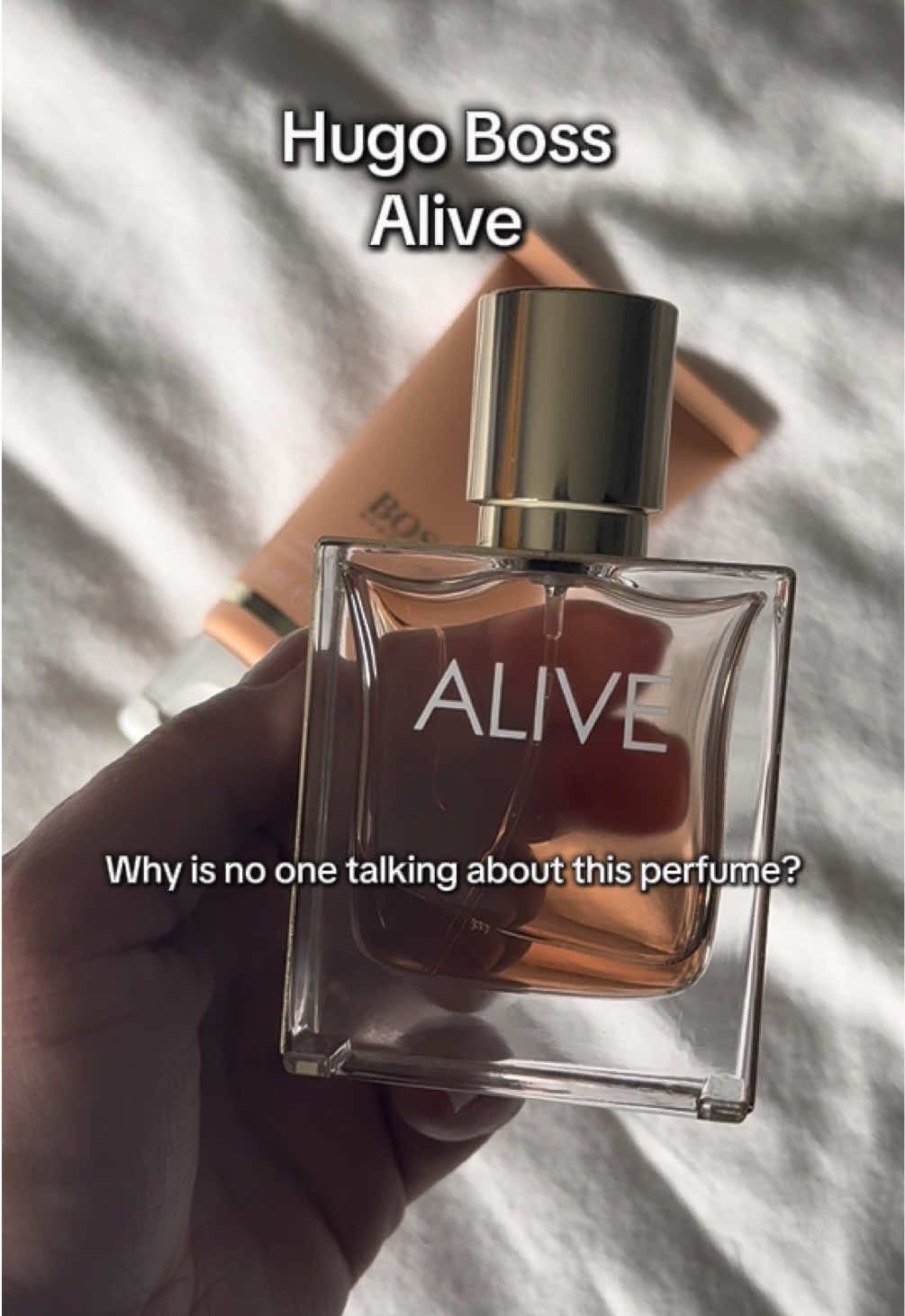 Why is no one talking about this perfume?  Top notes: plum, apple, cinnamon, blackcurrant; Heart notes: Madagascar vanilla, jasmine sambac, thyme; Base notes: Chinese cedarwood, sandalwood, olive wood, Alaskan golden wood. #perfumetok #perfumerecommendations #womenperfume #fragrancetiktok #hugobossalive #hugobossperfume #vanillafragrance #fyp 