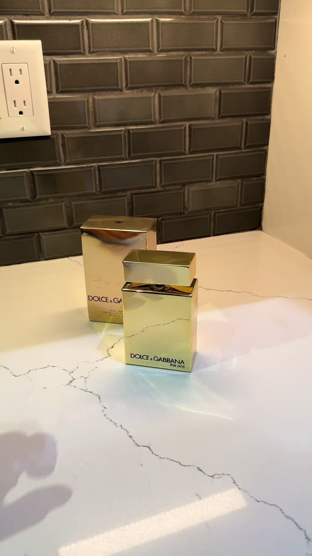 A touch of elegance captured in a golden bottle. Dolce & Gabbana The One radiates timeless sophistication with its rich, warm, and sensual notes the ultimate fragrance for those who love to stand out. @Dolce & Gabbana ✨ ✨ Golden elegance in every spray. Dolce & Gabbana The One because being unforgettable is the only option. 🌹✨ 🌸 Notes  Top: Bergamot, Peach, Lychee | Heart: Jasmine, Lily, Plum | Base: Vanilla, Amber, Musk #DolceGabbana #fyp #LuxuryFragrance #trendingvideo #viral 